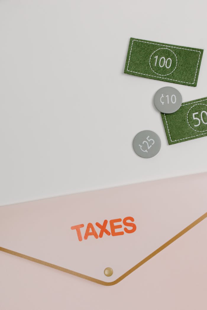 Minimalist image showcasing a tax-themed envelope and currency icons, perfect for finance concepts.